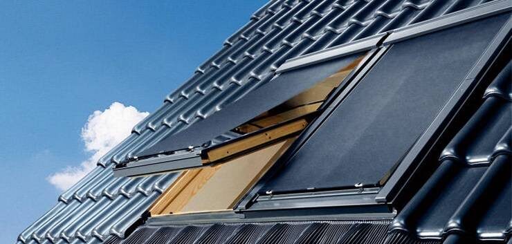 Two roof windows with anti-heat VELUX MHL awning blind